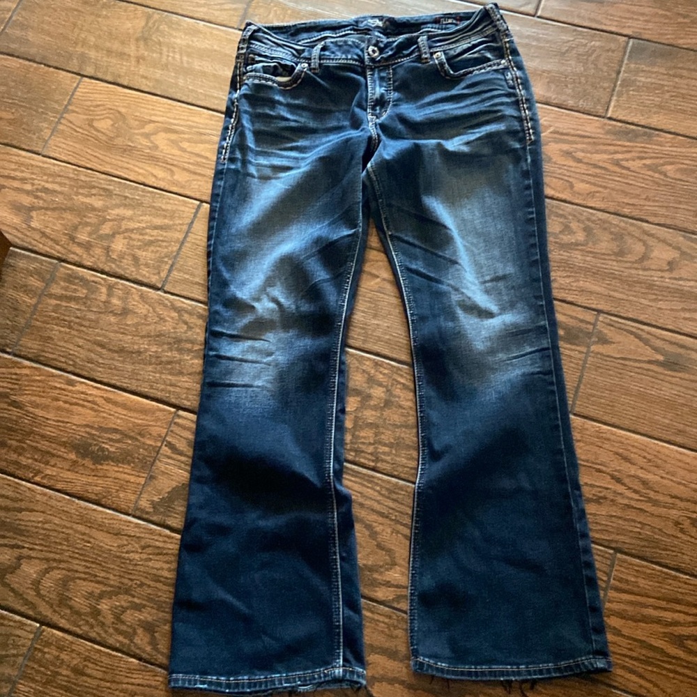 Silver dark wash jeans.